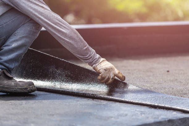 Professional Exterior Waterproofing technician working in Le Roy, NY